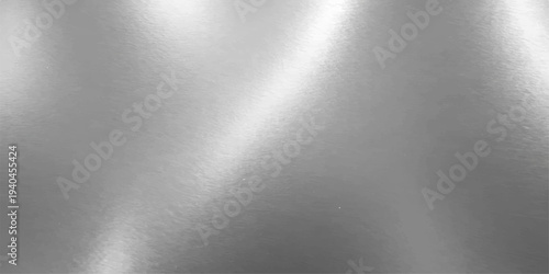 Shiny brushed silver steel metal texture with a polished stainless aluminum plate surface and gray metallic industrial material reflection for a textured grey backdrop wallpaper pattern