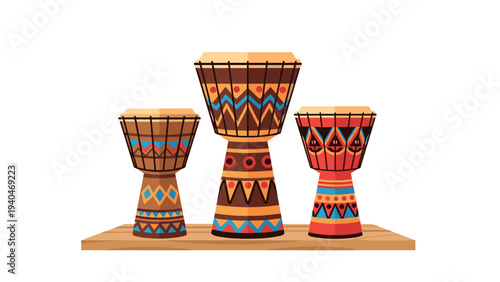 Colorful african djembe drums with geometric patterns on wooden platform