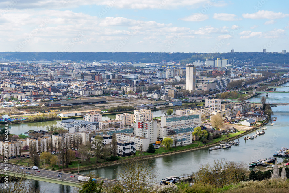 Obraz premium Rouen urban panorama with cathedral towers, bridges and river bends viewed from Cote Sainte Catherine hill. Iconic Normandy travel destination showing historic architecture and city landscape