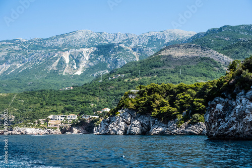 Scenic rocks and ancient town in Montenegro with amazing mountain nature view from Adriatic sea. Mediterranean landscape and old balkan city