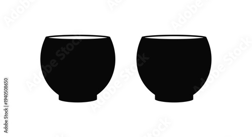 Two black ceramic bowls presented in a striking silhouette