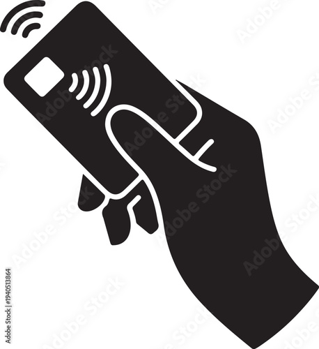 A human hand holds a credit card displaying symbols for contactless payment technology