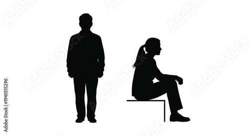 Two people in black one standing and one seated a striking silhouette