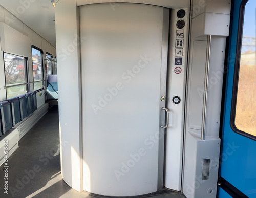 Fotografia Modern accessible train toilet, WC with sliding door and disability signs