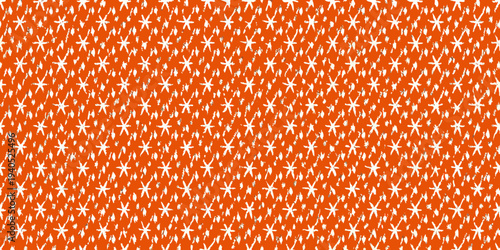 Bright orange background filled with small scattered white starburst shapes