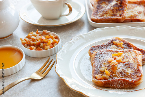 Torrijas de Semana Santa - traditional homemade Spanish dessert with orange sirup in Easter