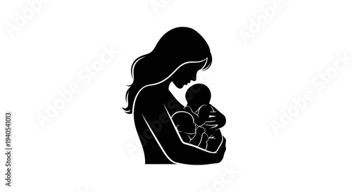 Mother holding baby in her arms tenderly.