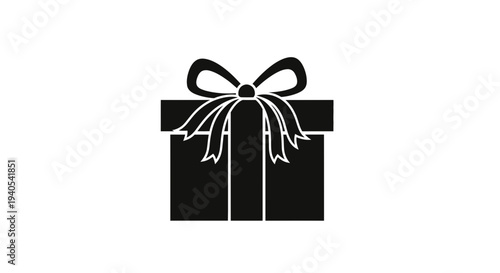 Black gift box with a ribbon and bow on a white background.