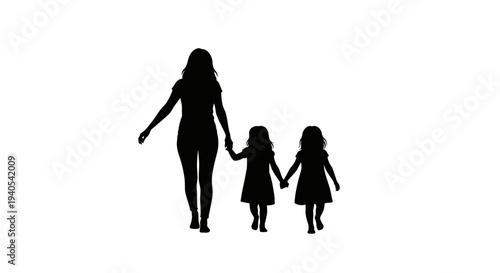 Silhouette of a mother holding hands with two daughters walking together.