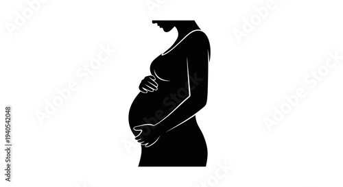 Silhouette of a pregnant woman touching her belly.