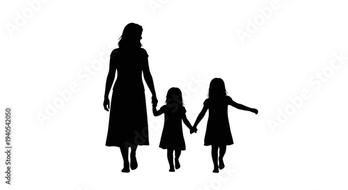 Silhouette of a mother holding hands with two daughters walking together.
