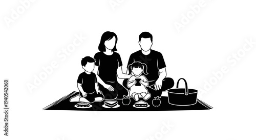 Family having a picnic together on a blanket.
