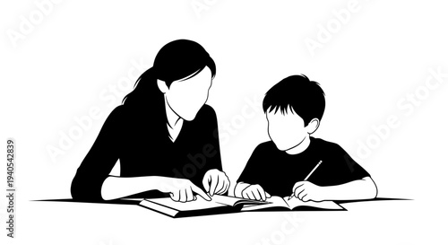 Mother and son studying together at a table.