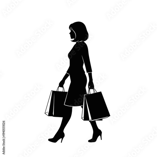 Confident woman walking with shopping bags in hand