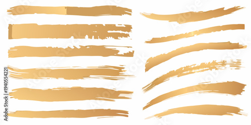 Collection of golden brush strokes and textured paint swipes