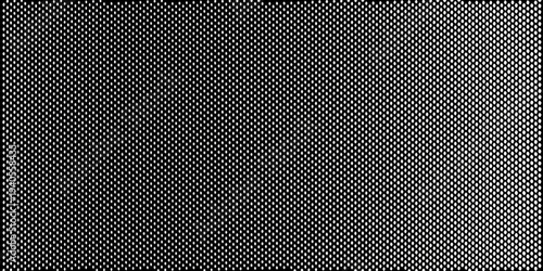 Dense repeating diamond pattern in stark black and white tones