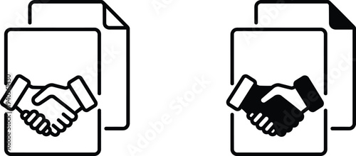 Two hands shaking over documents in a business agreement