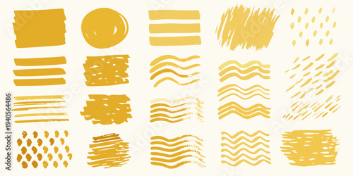Abstract arrangement of various golden yellow brushstroke shapes and patterns