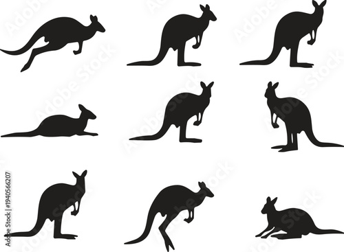 Focused young student studying with books and laptop in modern library, higher education concept, academic research, professional college campus environment.