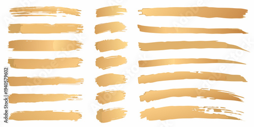 Collection of golden brush strokes and paint smears on white