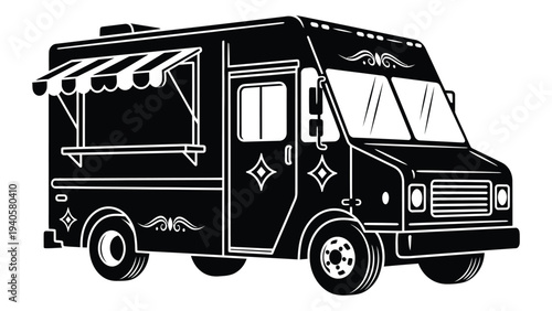 A black food truck with a striped awning