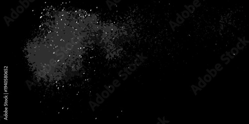 Abstract dark background with scattered white and gray speckles