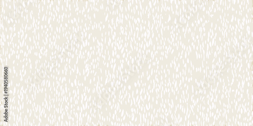 Abstract beige background with subtle scattered white linear markings