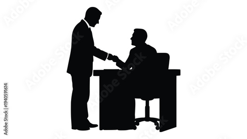 Two businessmen shaking hands over a desk