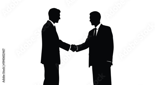 A striking silhouette depicts two business professionals completing a firm handshake symbolizing agreement and partnership in a formal setting