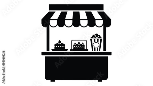 A food cart with a striped awning and desserts