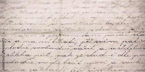 Close up of old handwritten Czech document showing part of a vintage land purchase contract about establishing a right of habitation, aged paper with calligraphic ink writing, no personal data