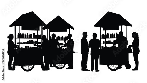 Silhouette of people standing next to food carts
