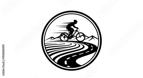 Cyclist riding on a winding road through mountains.