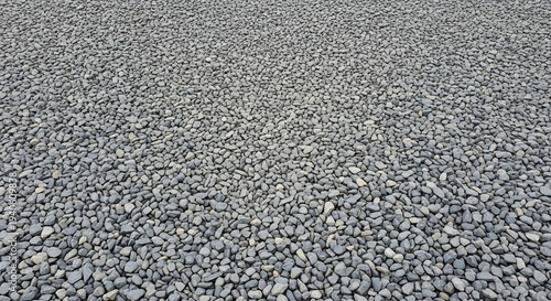 Close-up View of a Textured Surface Covered in Small Gray Gravel Stones.