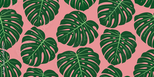 Seamless pattern of vibrant monstera leaves against a soft pink backdrop