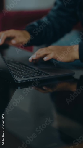 Closeup of man hands using touchpad on laptop keypad. Unrecognized freelancer browsing internet computer doing online report in agency. Student employee study remotely at desk.