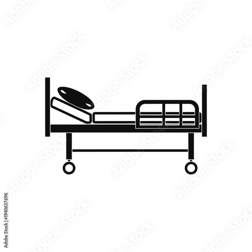 Hospital bed with pillows and footboard on wheels isolated on white background.