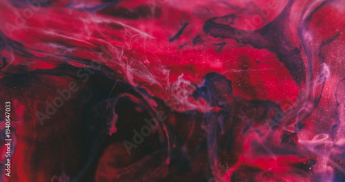 Liquid paint fog. Color mix smoke. Defocused purple red blue water spreading glitter splash droplet steam art cloud on abstract background.