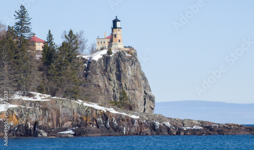 Lighthouse high on rocky cliff along Lake Superior