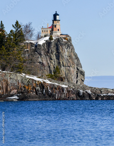 Lighthouse high on rocky cliff along Lake Superior