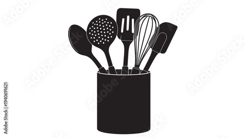 Black kitchen utensils including spatula, whisk, and slotted spoon in a cylindrical container viewed from the front