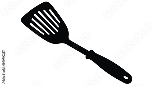 Black kitchen spatula shown in a striking graphic silhouette