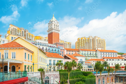Mediterranean style resort district in Sunset Town, Phu Quoc, Vietnam, with pastel buildings with terracotta roofs and Venetian inspired clock tower. Italian architecture in Asia