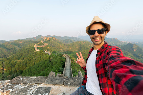 Handsome man taking a selfie in The Great Wall of China