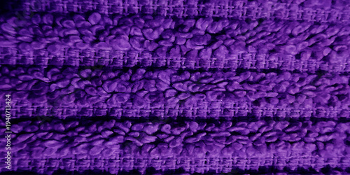Purple knitted fabric. Purple wool texture. Closeup sweater cotton material. Woolen hand craft macro clothing fabric fashion design. Horizontal stripe fabric textile cloth background.