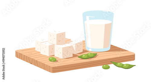 A wooden cutting board holds several tofu cubes, a glass of soy milk, and scattered edamame beans on a white surface.
