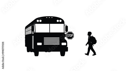School bus and walking student near a stop sign a black silhouette