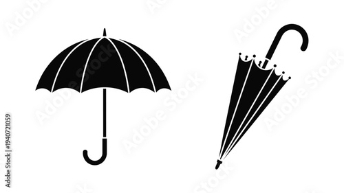 Two umbrellas one open and one closed in stark black silhouette