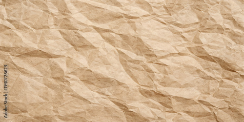 A vintage aged sheet of crumpled brown paper features a rough wrinkled texture and a dirty grunge surface, creating a blank antique parchment backdrop with a creased pattern on the old material