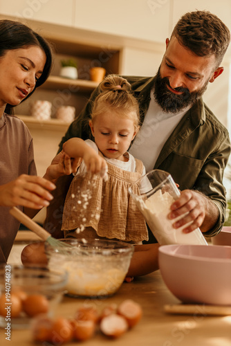 Photos Happy family baking together in modern kitchen